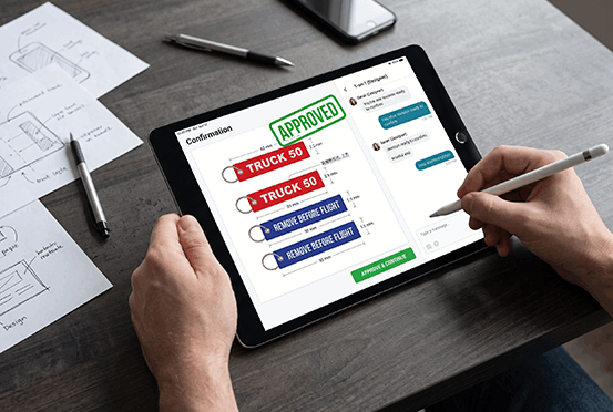 Customer reviewing and approving a flight tag digital proof on a tablet